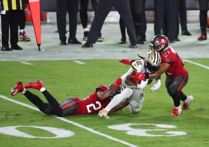 New Orleans Saints Alvin Kamara (41) runs with the ball as Tampa Bay Buccaneers safety Antoine Winfield Jr. (31) defends. Mandatory Credit: Kim Klement-USA TODAY Sports